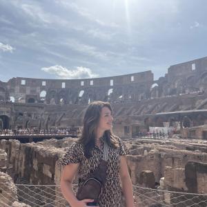 Elsie McCabe standing in the Colosseum