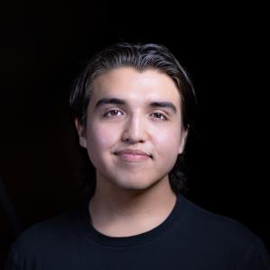 Smiling profile of our young Native American former Alumn and Panelist