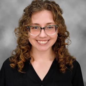 A headshot photo of Olivia