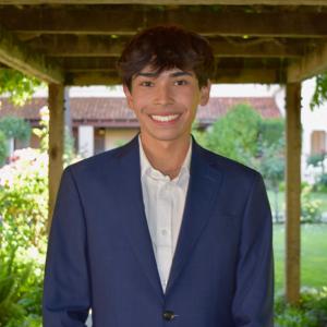 Kai smiling at the camera