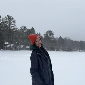 Lara Jomaa smiling and posing in the snow.