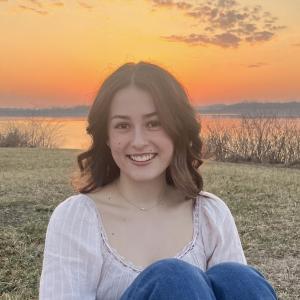 Hannah Mattison smiling in front of sunset