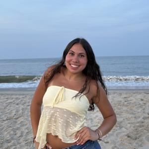 Julia Davis smiling on beach