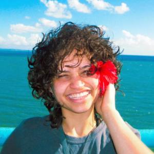 Lerianis Colon-Nieves smiling with flower in hair