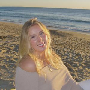 Ava Lehn smiling on beach