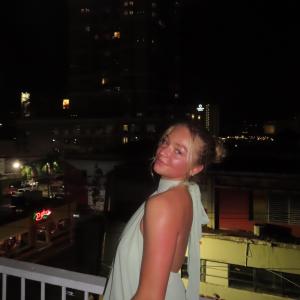 Samantha Pratt smiling on balcony