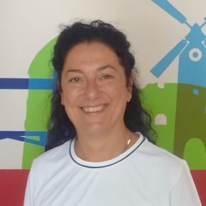 Academic Manager Francesca poses wearing a white shirt.