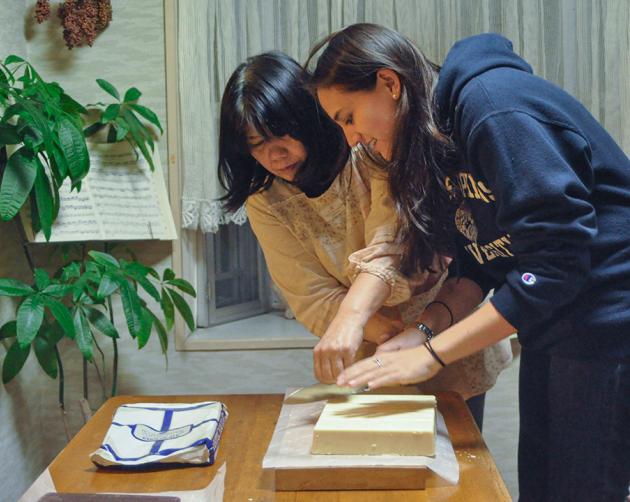 A student and their host mother cut tofu together in a Nagoya Homestay.