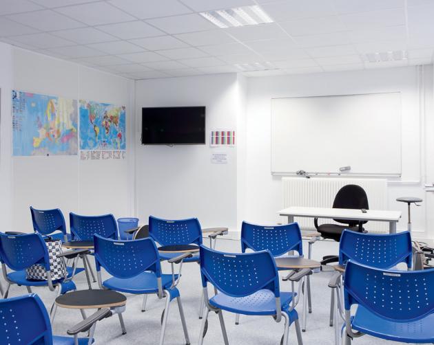 Interior of the Center in Paris, blue chairs, clean white walls