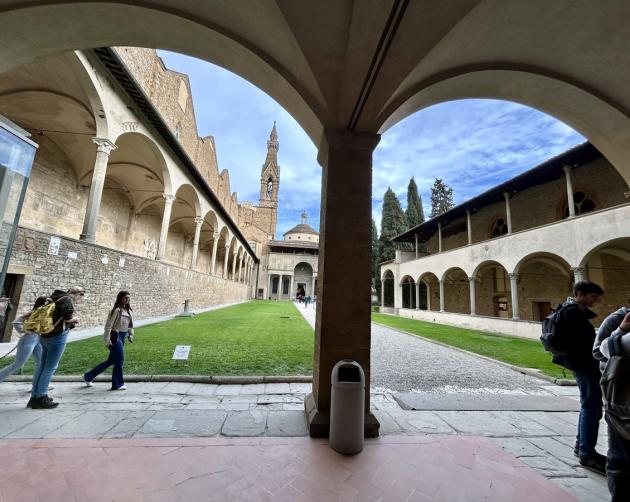 Courtyard in Florence with students walking through it