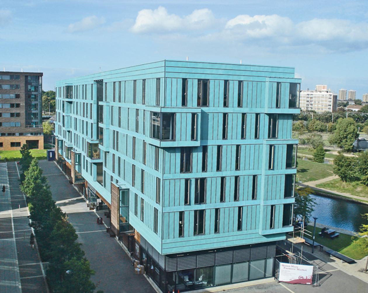 A bright blue building, the France House, sits on the campus of the University of London-Queen Mary.
