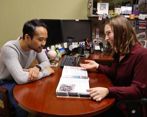 a student exploring study abroad options with their advisor