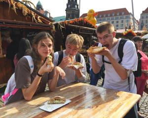 students eating German food at a festival in Dresden