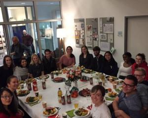students celebrating thanksgiving at the table in Berlin 