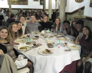 students celebrating thanksgiving at the table
