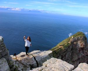 A student takes a selfie in front of Cape Point in Cape Town, South Africa.