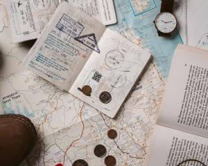 A student's passport laying on a map 