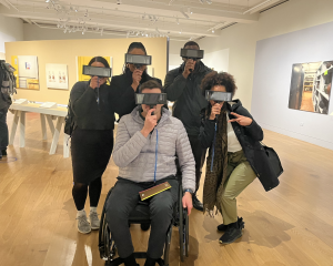 Group of people in a museum with goggles on.
