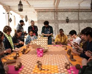 students in pottery workshop in Morocco 