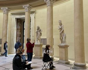 Students sketching in a museum 