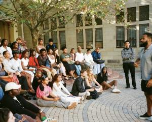 Students sitting in a courtyard in Cape Town for class