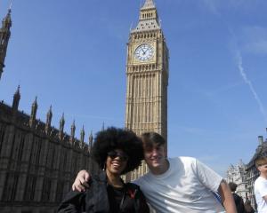 Two students smiling at Big Ben in London