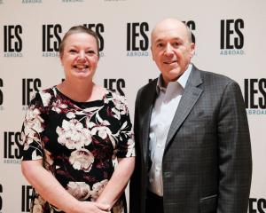 A woman and man standing side-by-side.