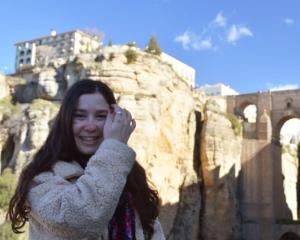 Hannah Geller smiling at the camera person while exploring Granada 