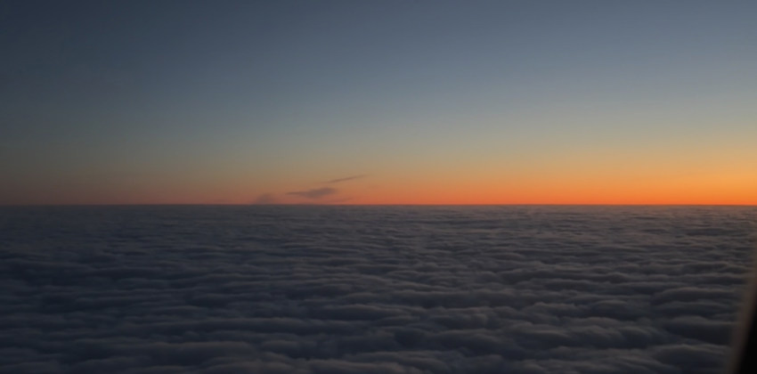 This is a photo I took on my flight to Berlin with the sun rising over the clouds!