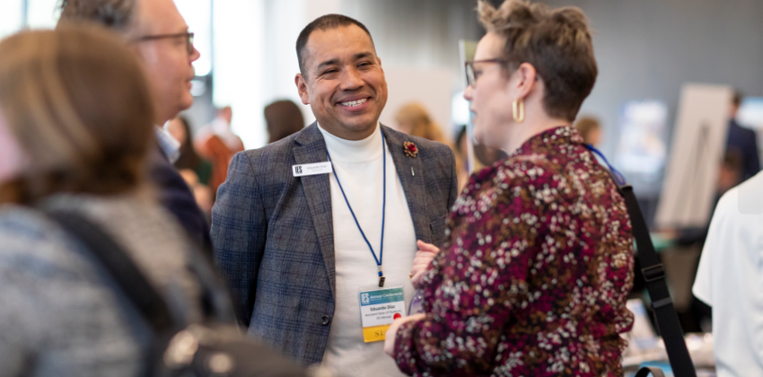 Colleagues talking at Annual Conference 