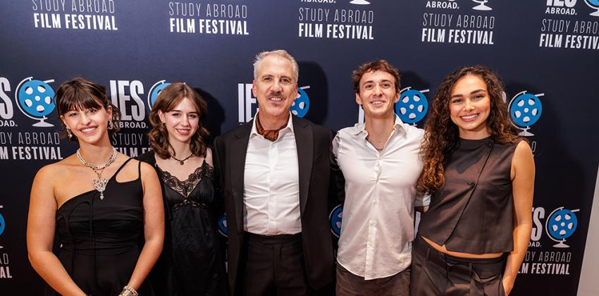 Student Film Fest Winners in front of a banner