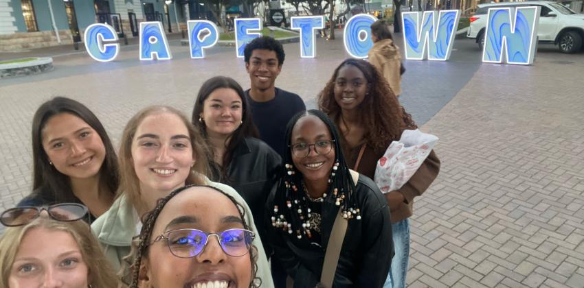 Group of students taking a selfie in front of Cape Town sign