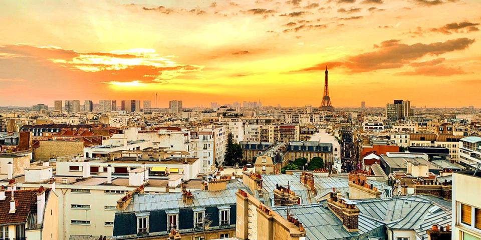a view of Paris from the rooftop during sunset