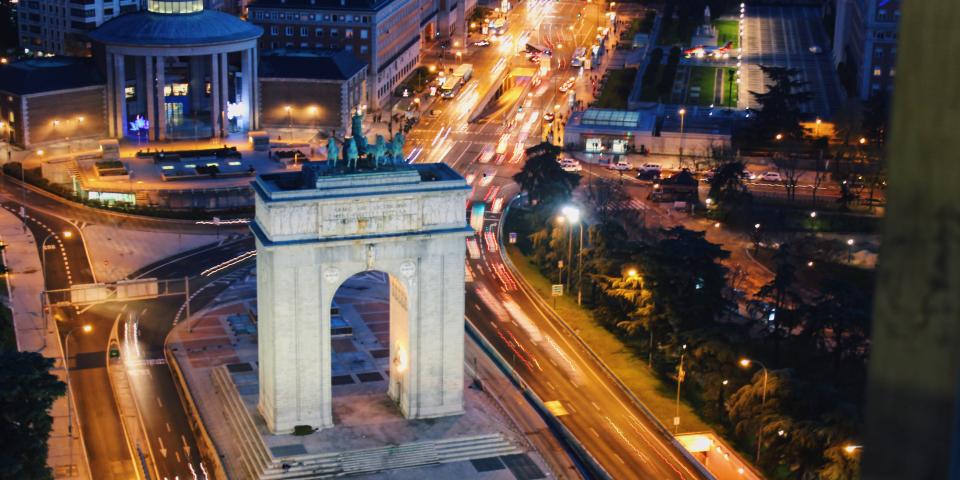 an aerial view of Arco de la Victoria in Madrid at night
