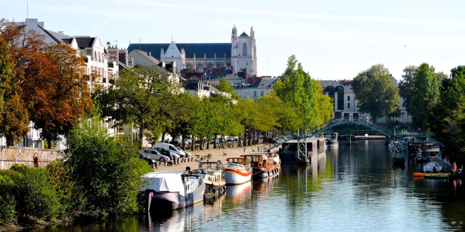 a photo of the Loire River crossing through the city of Nantes