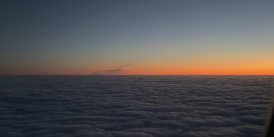 This is a photo I took on my flight to Berlin with the sun rising over the clouds!