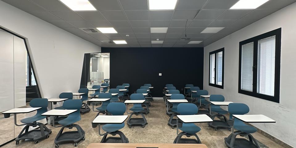 A classroom with windows and desks